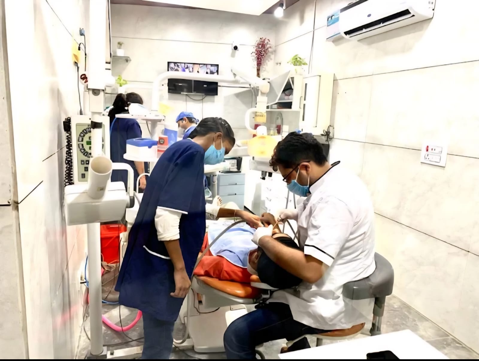 Dr. Aniket Gupta treating a patient at Gupta Dental Clinic